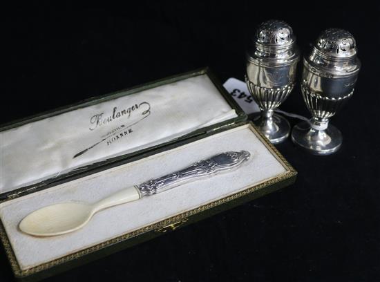 A pair of late Victorian silver pedestal pepperettes by Dobson & Sons, London, 1895 and a cased caviar spoon. 3.75in.